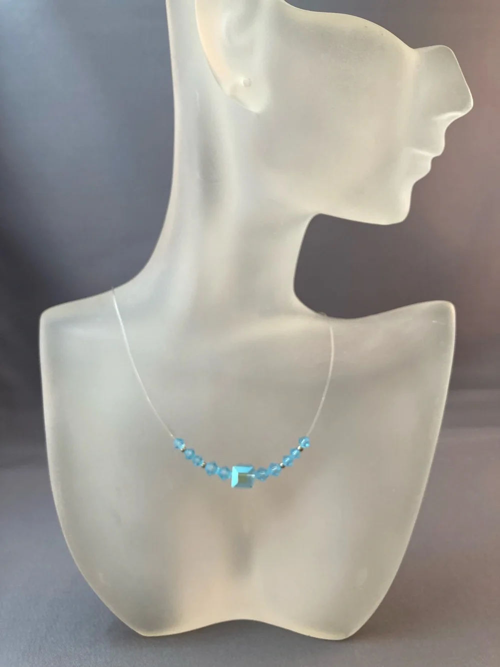 Light blue crystal bead necklace on monofilament 15 inches
